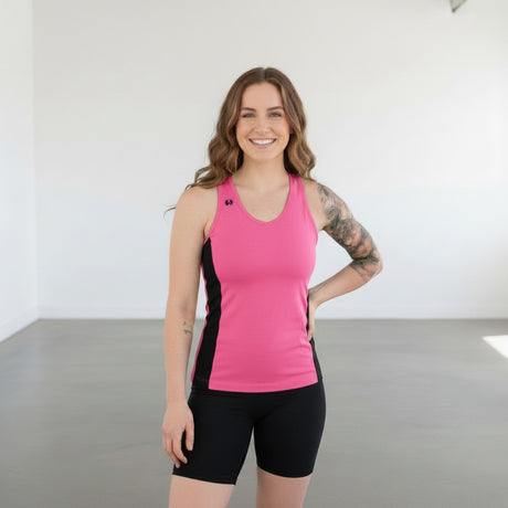 Pivotstar pink and black athletic jersey with a fitted body and racerback. Made from wicking, quick-dry material.