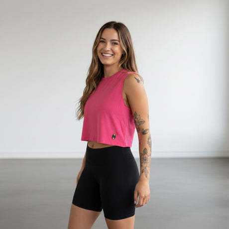 Pivotstar pink heathered box crop top with a loose fit and crew neck, perfect for track or gym.
