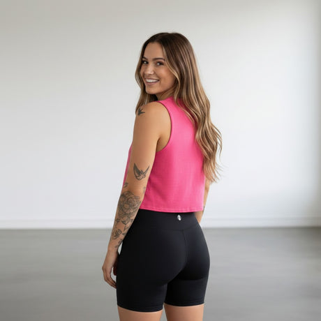 Pivotstar pink heathered box crop top with a loose fit, perfect for the gym or track.