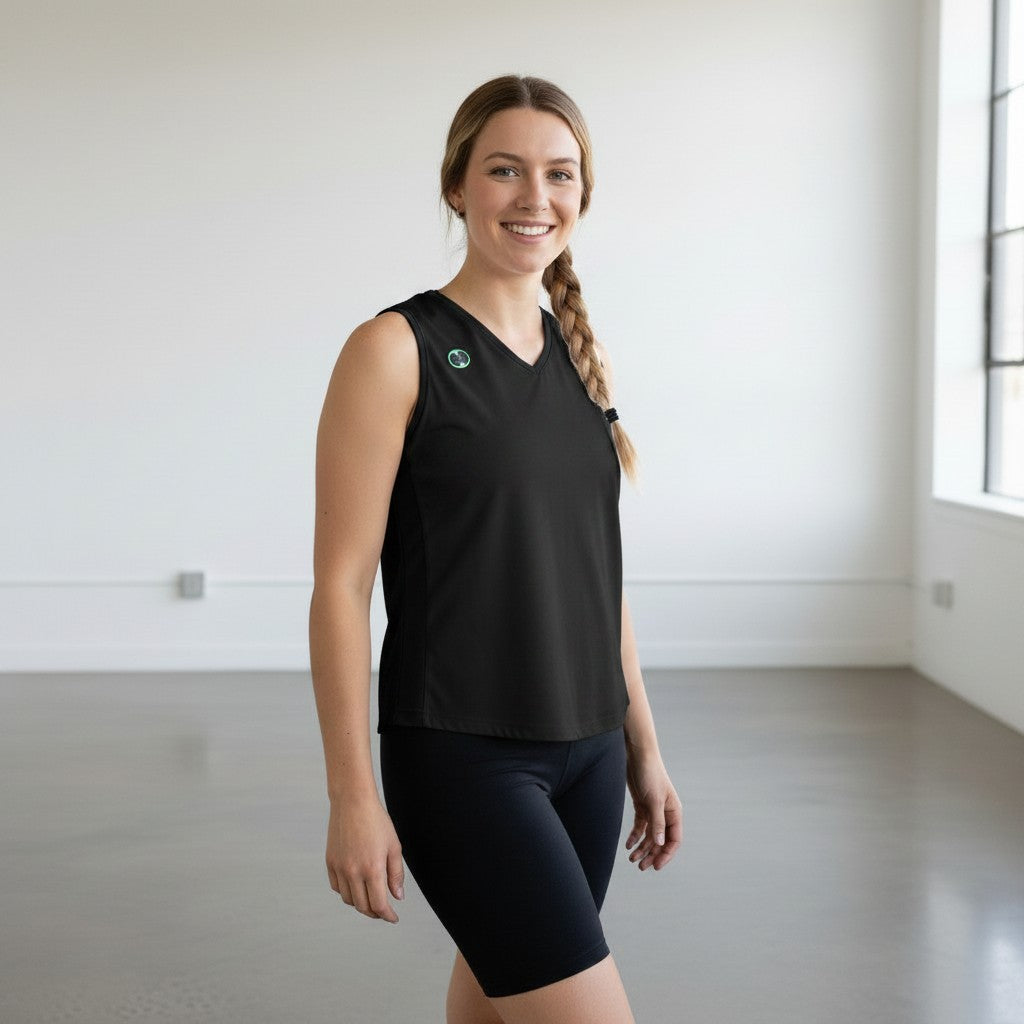 Pivotstar white sport fit jersey with black side panels and v-neck, worn by a smiling woman.