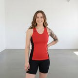 Pivotstar yellow and black athletic tank top with racerback and fitted body, made of wicking material.