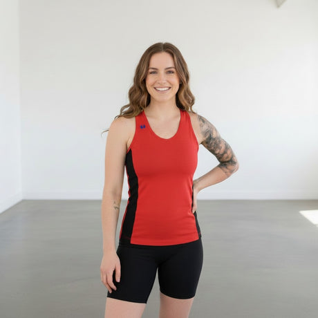 Pivotstar yellow and black athletic tank top with racerback and fitted body, made of wicking material.